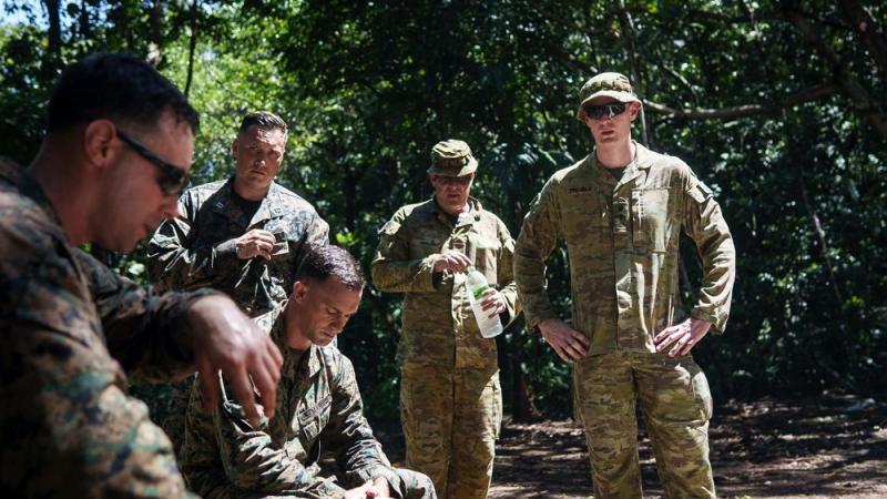 Army Sergeant Paul Waples is shown unexploded demolition techniques by United States Marine Corps 1st Lieutenant Molly Mcgrath while observing Task Force Koa Moana in Palau.