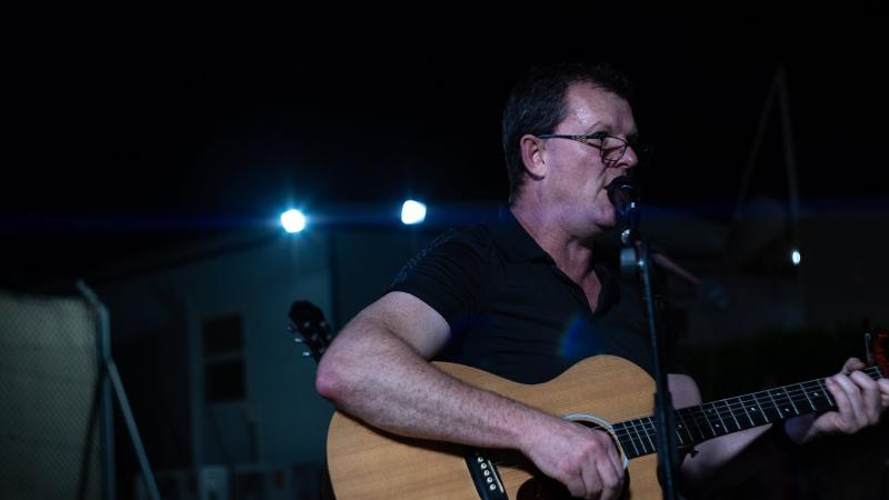 Squadron Leader Brendon Knopke performs for military personnel deployed on Operation Accordion. Photo: Sergeant Glen McCarthy