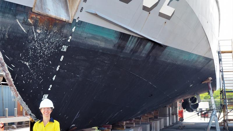 Pacific Patrol Boat Systems Program Office Director Kim Metcalf in front of Tuvalu’s Guardian-class patrol boat Te Mataili II, which is in Cairns for planned maintenance.