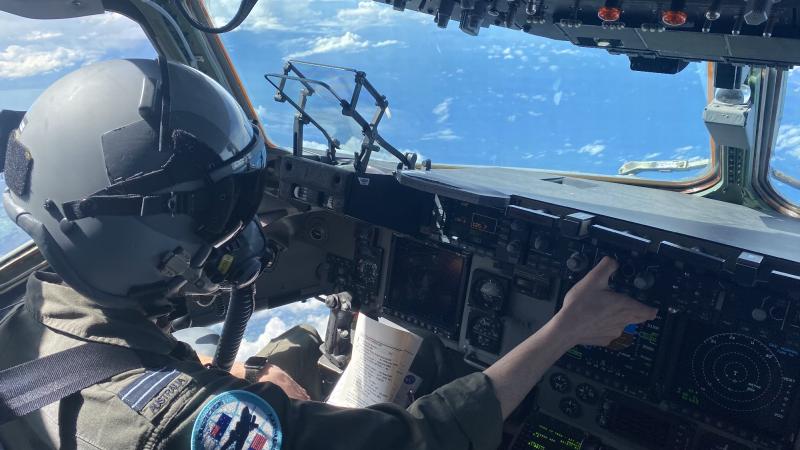 A RAAF pilot with No. 36 Squadron in the cockpit of a C-17A Globemaster during Exercise Global Dexterity 21. The helmet and oxygen mask are worn when performing  airdrops. Photo: Flight Lieutenant Matt Huber