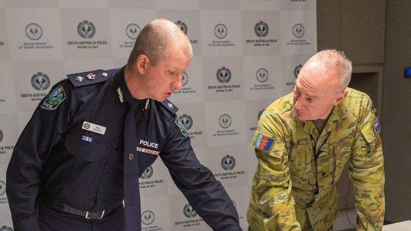 Superintendent Scott Denny, left, and Major Richard Moyses conduct strategic planning during Operation COVID-19 Assist. Photo: Leading Aircraftwoman Jacqueline Forrester
