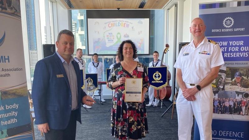 Petty Officer Nigel Barrett, left, with Western Australian Association for Mental Health CEO Taryn Harvey and Commanding Officer HMAS Stirling Captain Gary Lawton at the presentation of an Employer Support Award to the association in Perth.