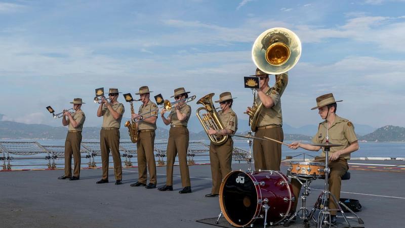 The Australian Army Band perform as HMAS Canberra comes alongside in Cam Ranh Bay, Vietnam, during a contactless port visit as part of Indo-Pacific Endeavour 2021. Photo: Leading Seaman Nadav Harel