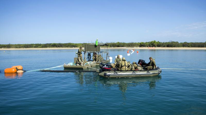 Australian Army petroleum operators set up a pontoon and towed flexible barge system at the Cowley Beach Training Area during Exercise Overland Nautical Petros 21.