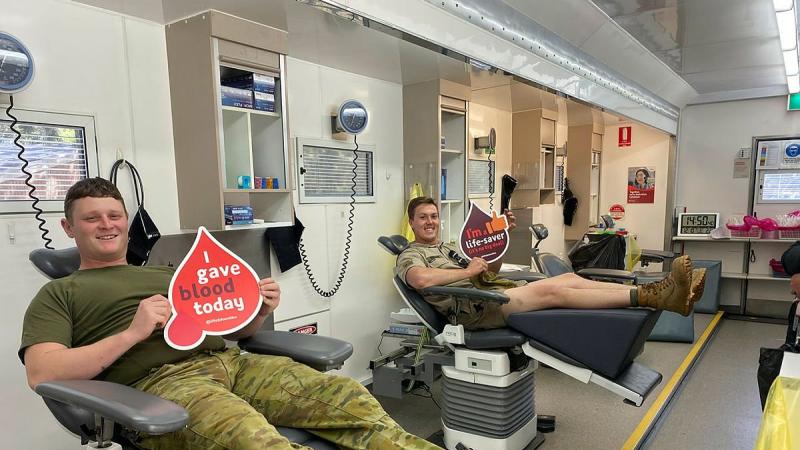 Corporal Aaron Hopgood, left, and Lance Corporal Matthew Bosman, of the 16th Regiment, Royal Australian Artillery, relax after donating blood at an Australian Red Cross Lifeblood mobile donor centre at Woodside Barracks, South Australia.