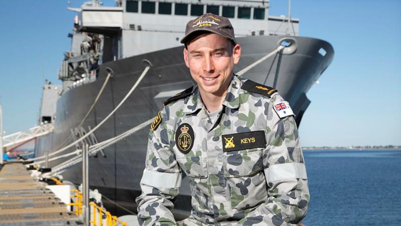 Able Seaman Joshua Keys in front of NUSHIP Stalwart at Fleet Base West in Western Australia. Photo: Chief Petty Officer Damian Pawlenko