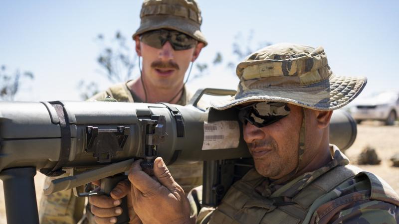Australian Army Private Ryan Robertson conducts weapon training on the 84mm Carl Gustav with Papua New Guinea Defence Force Corporal Shaun Bereda during Exercise Kumul Exchange 21 at the Townsville Field Training Area. Photo: Corporal Brandon Grey