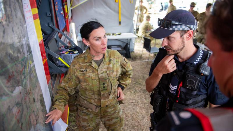 Lieutenant Misty Evans, of the 31st/42nd Battalion, Royal Queensland Regiment, briefs Queensland Polica and Queensland Fire and Emergency Service personnel on ADF search activity. Photo: Warrant Officer Class 2 Neil Ruskin