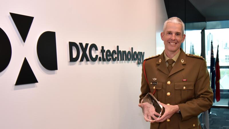 Army reservist Captain Gareth Morgan receives the Prince of Wales Award at his workplace, DXC Technology, in Fortitude Valley, Brisbane.