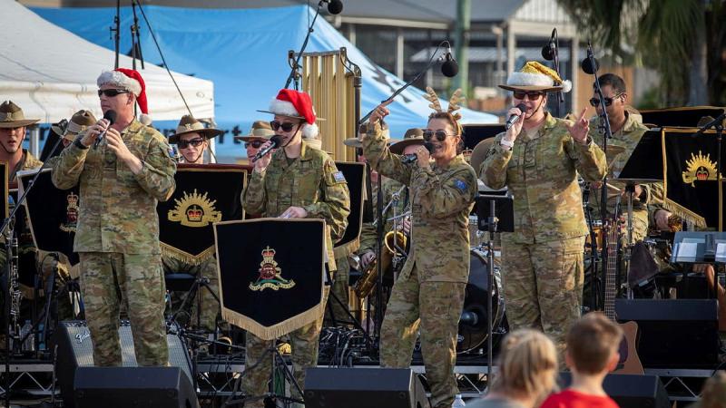 Musicians from the Australian Army Band Brisbane and Band of the 1st Regiment, Royal Australian Artillery, perform at Carols on El Alamein at Gallipoli Barracks in 2019. Photo: Trooper Jonathan Goedhart