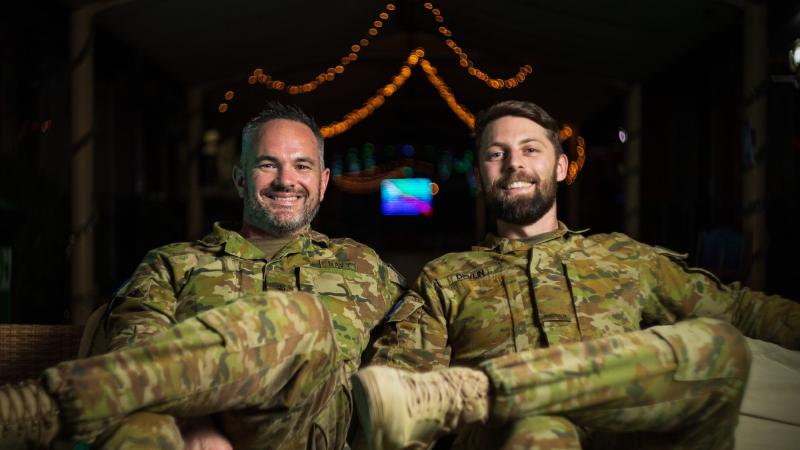 Navy Petty Officer Mark Butler, left, and Army Signaller James Devlin have produced a weekly podcast while deployed in the Middle East region. Photo: Sergeant Glen McCarthy