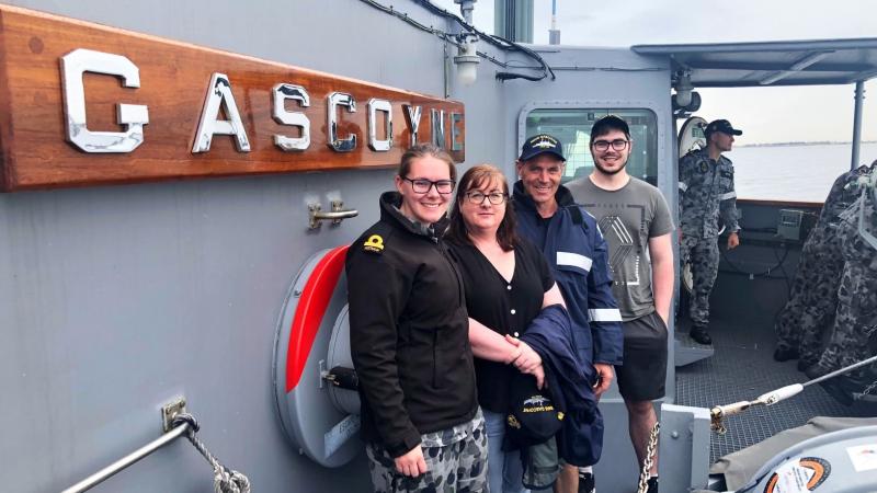 Officer of the watch Sub-Lieutenant Emma Bennett with her Mum, Dad and brother during a Family Day on board HMAS Gascoyne. 