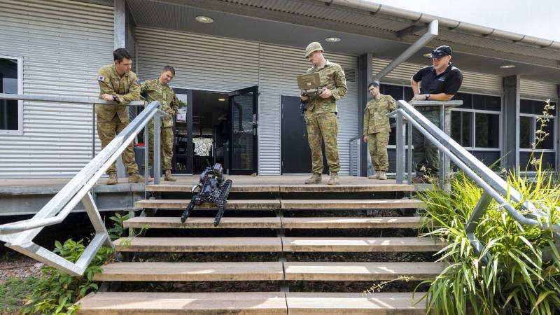 Australian Army Sapper Matthew Macdonald from the 3rd Combat Engineer Regiment manoeuvres a Squad Packable Utility Robot from EPE down a set of stairs during the trial phase at Lavarack Barracks, QLD, on 11 November 2021. Photo: Corporal Brodie Cross