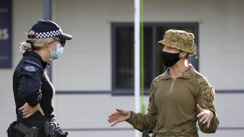 Australian Army Captain Celie Bright-Perry speaks with an AFP health planner during their deployment to Solomon Islands. Photo: Corporal Brandon Grey