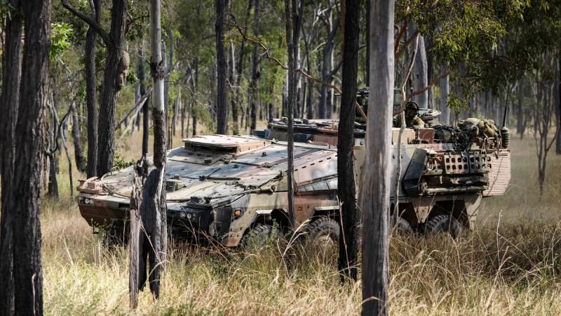 A Boxer Combat Reconnaissance Vehicle conducts a live-fire battle run during exercise Diamond Walk at Shoalwater Bay, Queensland. Photo: Private Jacob Hilton