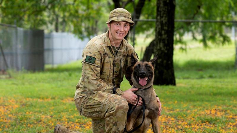 Leading Aircraftman Nicholas Catling and Military Working Dog Ben at RAAF Security and Fire School, RAAF Base Amberley. Photo: Leading Aircraftwoman Emma Schwenke