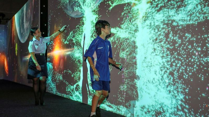 Leading Aircraftwoman Chantelle Bradford and Nailsworth Primary School student Lachlan enjoy the interactive experience of the Science Alive! expo in Adelaide. Photo: Corporal Brenton Kwaterski