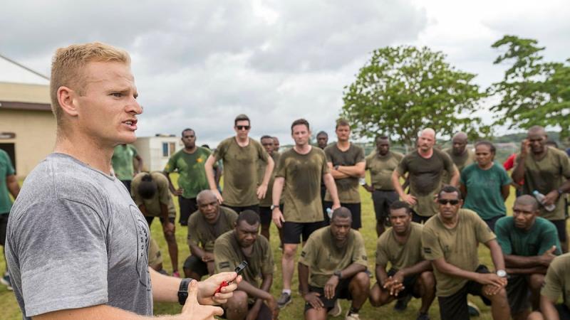 Australian Army combat fitness leader Gunner Wouter Gronum addresses members of the Australian Army and Vanuatu Police Force after a physical training session at Cook Barracks in Port Vila, Vanuatu. Photo: Corporal Robert Whitmore