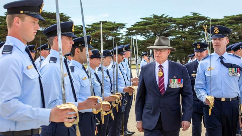 Governor-General General (retd) David Hurley inspects the graduating officers of the RAAF Initial Officer Course 06/21, escorted by parade commander Pilot Officer David Darnell at RAAF Base Point Cook. Photo: Leading Seaman James McDougall
