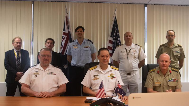 At the signing of the Memorandum of Understanding: Warrant Officer Andrew Jocumsen, Commodore Peter Leavy, Colonel James Murray, Andrew Nealy, Professor Michael O’Donnell, Group Captain Jeff Howard, Captain (USN) Matt Ort and Lieutenant Colonel Dave Cave.