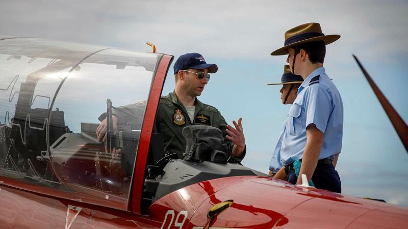 Chief Flying Instructor No. 2 Flying Training School Squadron Leader Shannon McGuckin discusses features of the Pilatus PC-21 with Australian Air Force Cadets at the Busselton Margaret River Airport Open Day. Photo: Sergeant Gary Dixon