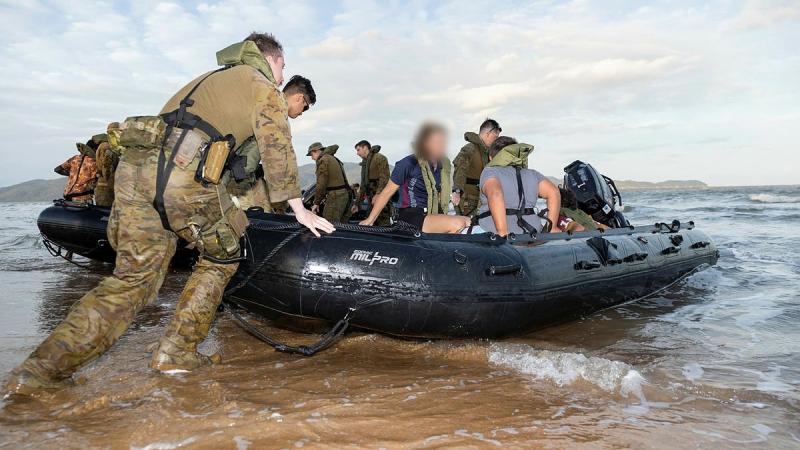 Soldiers from the 2nd Battalion, Royal Australian Regiment, prepare to take participants of the Proud Warrior Youth Engagement Program for a ride in the Zodiac MK2 inflatable boat at Pallarenda Beach, Queensland, in September. Photo: Corporal Brandon Grey