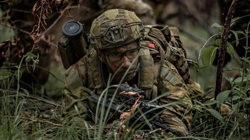 Private Eric Curll, from the 8th/9th Battalion, Royal Australian Regiment, scans the Enoggera Close Training Area for enemy role-players during Exercise Ram Strike. Photo: Private Jacob Hilton