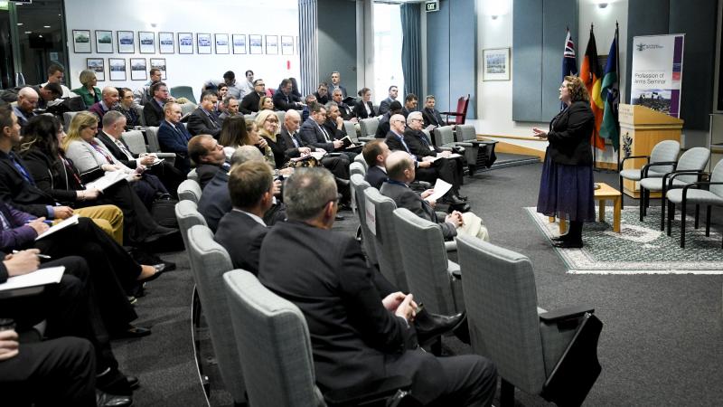 Dr Lacy Pejcinovic welcomes guests to the Profession of Arms Seminar at the Australian Defence College, Weston Creek, Canberra. Photo: Grace Costa Banson.