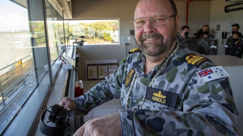 Officer-in-charge of the West Head gunnery range in Victoria, Lieutenant Commander Peter Arnold, prepares for a 76mm medium calibre firing against a towed surface target as part of annual continuation training. Photo: Petty Officer James Whittle