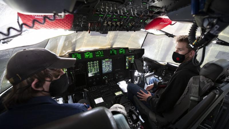 Summer School students on the flight deck of a No. 37 Squadron C-130J Hercules during a visit to RAAF Base Richmond, NSW. Photo by Corporal David Said.