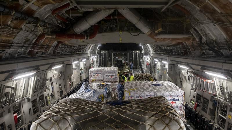 Pallets of humanitarian assistance and engineering equipment bound for Tonga, are loaded onto a RAAF C-17A Globemaster III, at RAAF Base Amberley. Photo: Leading Aircraftwoman Emma Schwenke