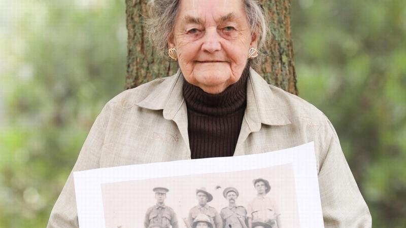 Private Edward Attfield’s great-niece, Beverley Warren, holds a photo featuring Private Attfield, who is believed to be the digger lying down. Photo: Able Seaman Bonny Gassner