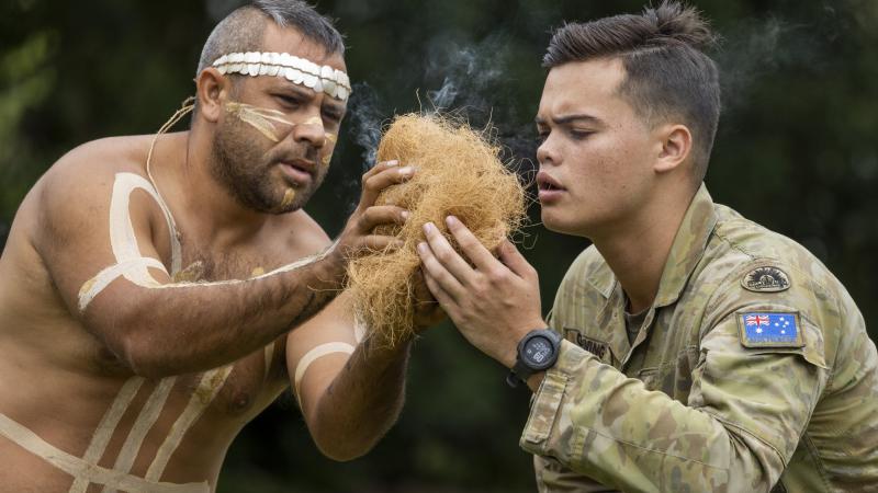 Private Raymond Gunning from 10th Force Support Battalion and Mr Les Tanna from the Wulgurukaba Walkabouts during the totem ceremony in Townsville. Photo: Corporal Brodie Cross.