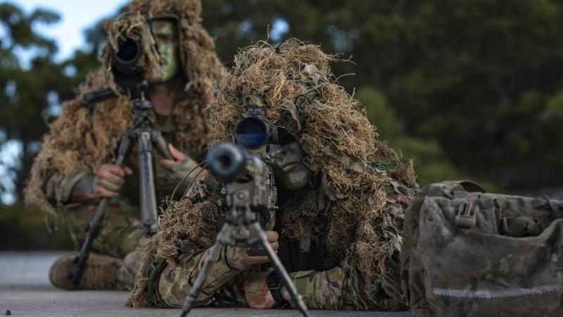 Sniper team Private Jack Sendall, front, and Lance Corporal Reece Tomlinson, from 6RAR, conduct live-fire practise with a .50-calibre anti-materiel rifle at Wide Bay training area in Queensland. Photo: Corporal Nicole Dorrett