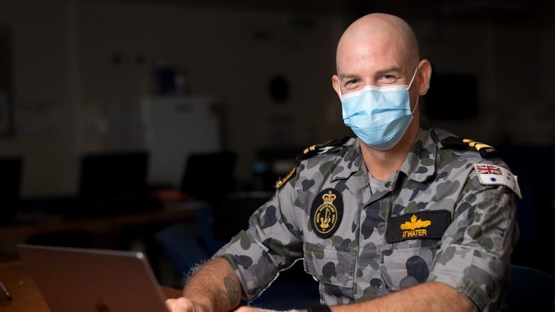 Navy meteorologist and oceanographer Lieutenant Daniel Atwater on board HMAS Adelaide during Operation Tonga Assist 2022. Photo: Corporal Robert Whitmore.