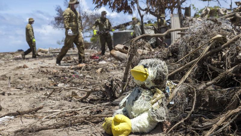 Army engineers from No. 2 Combat Engineer Regiment begin the clean-up on Atata Island, Tonga. Photo: Corporal Robert Whitmore.