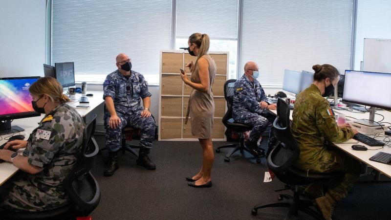 ADF personnel from the Aged Care Support Planning and Coordination Team working with Department of Health personnel in Canberra. Photo: Kym Smith