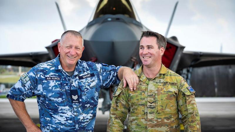 Air Force aircraft technician Sergeant Steven Grant, left, and airfield defence guard Leading Aircraftman Jason Grant, who are also father and son, catch up during Exercise Cope North at Andersen Air Force Base, Guam. Photo: Leading Aircraftman Sam Price
