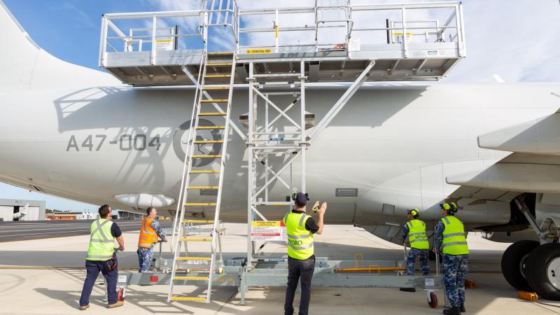 Surveillance and Response Systems Program Office (SRSPO) members test out the United States and Australian versions of the 737 P-8A Fuselage Stand. Photo: Leading Aircraftwoman Jacqueline Forrester