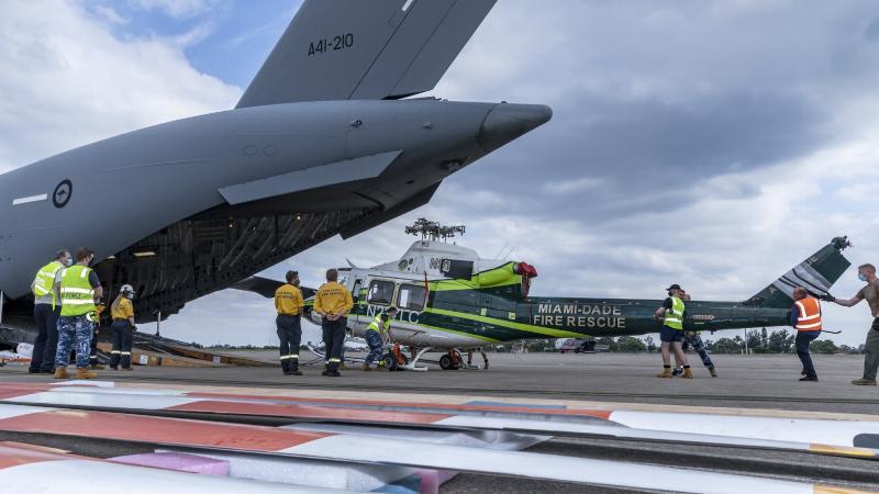 The New South Wales Rural Fire Service’s newly acquired Bell 412 helicopter is unloaded from a RAAF C-17A Globemaster III at RAAF Base Richmond. Photo: Corporal Dan Pinhorn