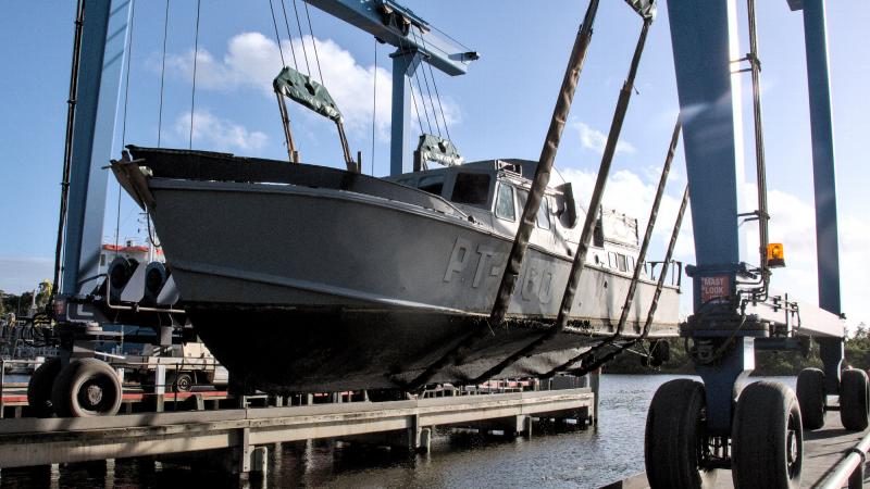 Former Air Force search and rescue boat O2-06 is pulled from the water at Lakes Entrance in Victoria for transport to an Air Force History and Heritage Branch facility in Spotswood, Melbourne. Photos: Flight Lieutenant Christopher Moon