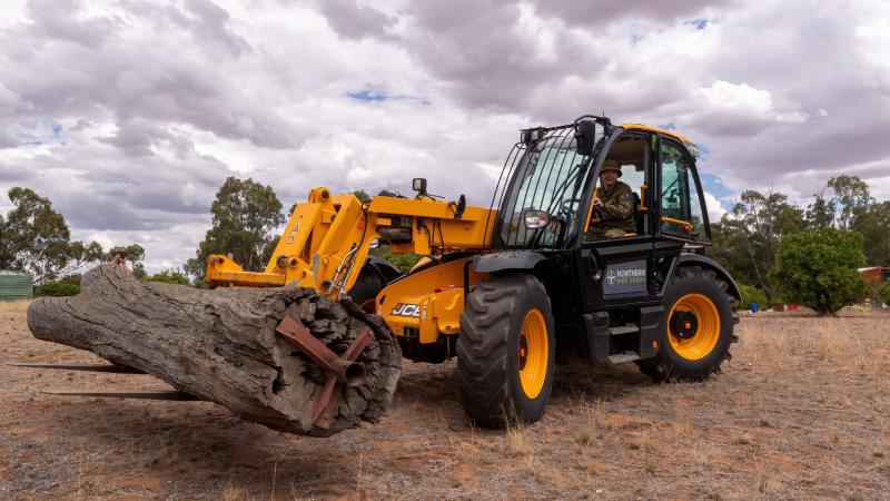 Sergeant Duncan Keith moves the scar tree into position. Photos: Private Michael Currie