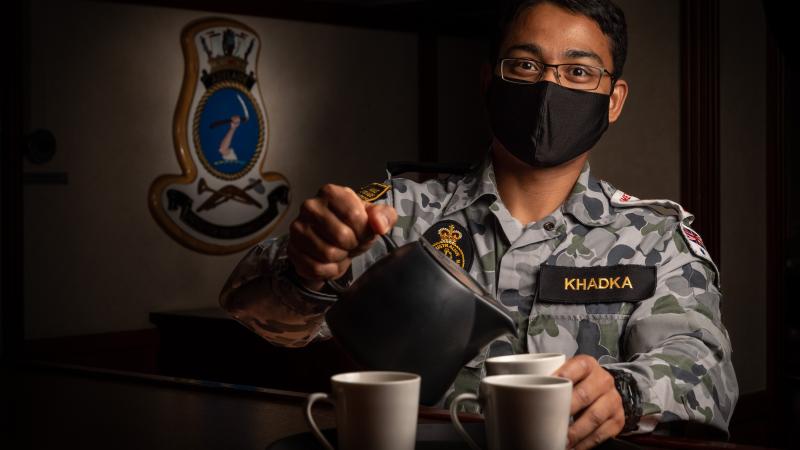 Navy sailor Seaman Dhan Khadka in HMAS Adelaide's wardroom during his deployment on Operation Tonga Assist 2022. Photo: Leading Seaman David Cox
