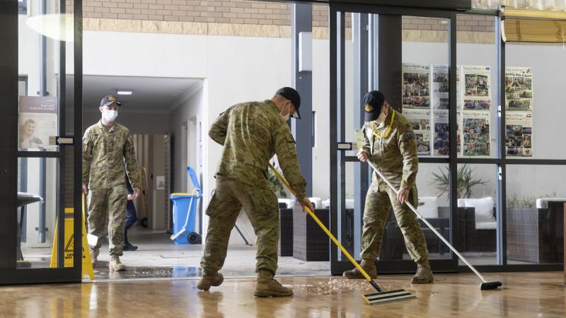  Soldiers from 5th Battalion, Royal Australian Regiment, assist with the clean-up at a nursing home in Brisbane. Photo: Leading Air Crewman John Solomon