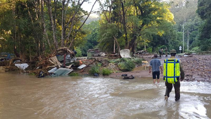 Australian Army soldiers from 41st Battalion, Royal New South Wales Regiment, survey flood devastation near Upper Main Arm during Op Flood Assist 2022.