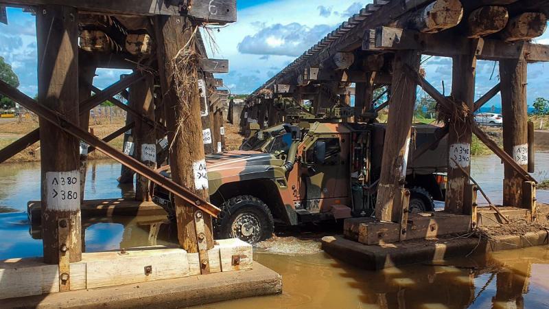 Members from the 2nd/14th Light Horse Regiment (Queensland Mounted Infantry) clears a route for SES in Gatton in Queensland. 