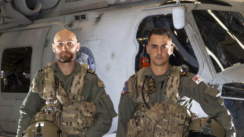 Leading Seamen Aircrew Michael Bennet, left, and Leading Seamen Aircrew Liam Sulley at 816 Squadron at HMAS Albatross, Nowra, after completing their rescue mission during Operation Flood Assist 2022. Photo: Leading Seaman Ryan Tascas