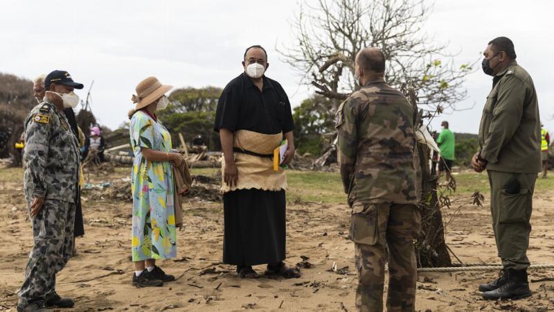 Tonga’s Prime Minister Siaosi Sovaleni (centre) and Australian High Commissioner to the Kingdom of Tonga, Rachael Moore (centre left), talk with military personnel from the Royal Australian Navy, French Armed Forces and the Republic of Fiji Military Force
