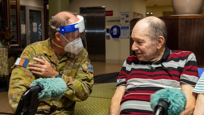 Corporal Mark Bennett with Rodney Crocker at the Pearl Retirement Village aged-care facility in Darwin. Photo: Corporal Rodrigo Villablanca