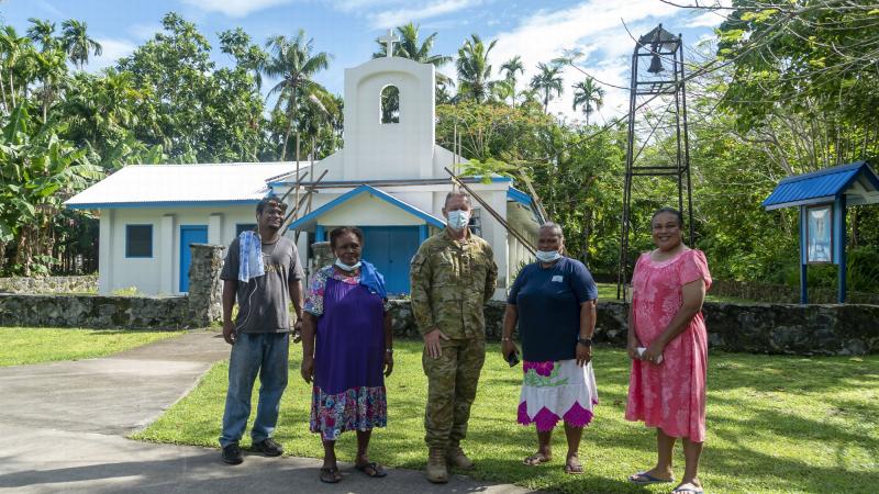 Australian Army pastor Chaplain Stephen Copland joins local parishioners outside Our Lady of Rosary Church in Angaur, Palau. Photo: Corporal David Cotton